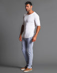 Man modeling the milano pant in blue clay