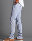 Man modeling the milano pant in blue clay