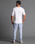 Man modeling the milano pant in blue clay