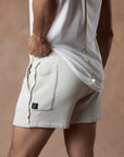 male modeling white stone resort shorts