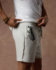 male modeling white stone resort shorts