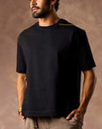 male modeling black boxy tee