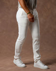 male modeling white elemental slim pants