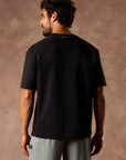 male modeling black boxy tee