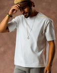 male modeling white boxy tee