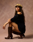 female modeling black boxy tee