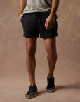 male modeling black resort shorts