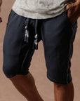 Man modeling milano mids in charcoal blue