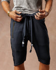 Man modeling milano mids in charcoal blue