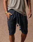 Man modeling milano mids in charcoal blue