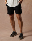 male modeling black resort shorts
