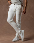male modeling white elemental slim pants