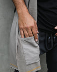 Male modeling grey fleece scarf