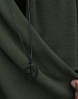 Man modeling green fleece scarf