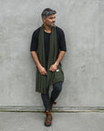 Man modeling green fleece scarf