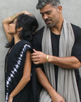 Two models modeling fleece scarves