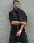 Man modeling slate fleece scarf