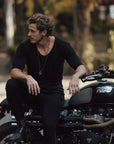 Male modeling black v neck shirt
