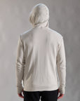 Man modeling a white stone hoodie