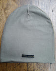 The One Golden Thread OG Cloud Beanie in Shroom with the saying "You are golden"
