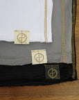 Flat lay of ultimate tee three pack in different colors
