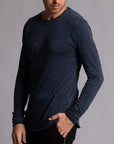 Man modeling a long sleeve crew shirt in charcoal blue
