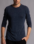 Man modeling a long sleeve crew shirt in charcoal blue