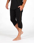 Male modeling black yogo mid shorts
