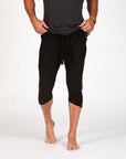 Male modeling black yogo mid shorts