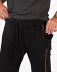 Male modeling black yogo mid shorts