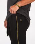 Male modeling black yogo mid shorts