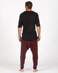 Male modeling Bordeaux colored pants