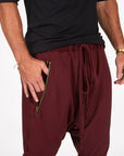 Male modeling Bordeaux colored pants