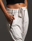 Woman modeling dance pants in White Stone