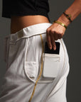 Woman modeling dance pants in White Stone