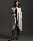 Woman modeling white aion duster