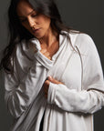 Woman modeling white aion duster