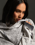 Woman modeling mineral grey aion duster