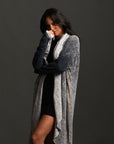 Woman modeling mineral grey aion duster
