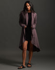 Woman modeling lavender aion duster