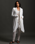 Woman modeling white aion duster