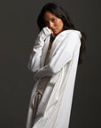 Woman modeling white aion duster