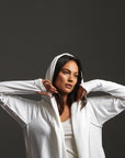 Woman modeling white aion duster