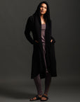 Woman modeling black aion duster