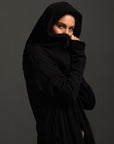 Woman modeling black aion duster