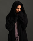 Woman modeling black aion duster
