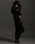 Woman modeling black aion duster