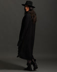 Woman modeling black aion duster