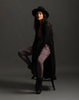 Woman modeling black aion duster