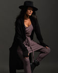 Woman modeling black aion duster